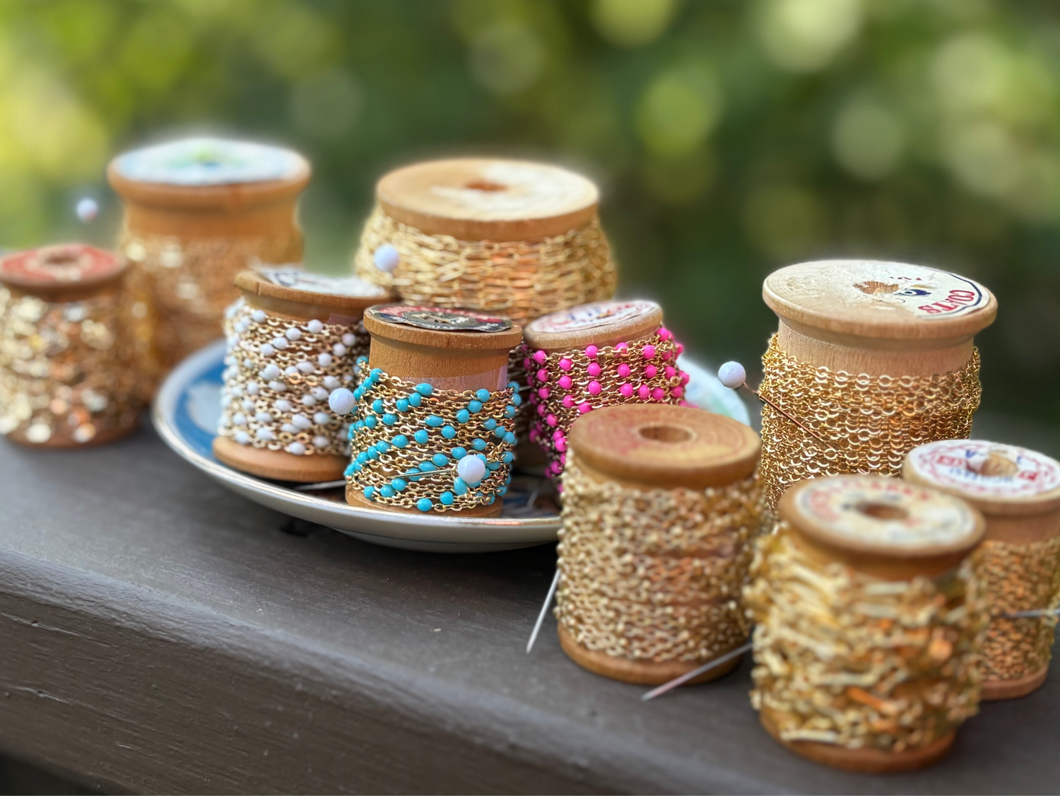 Photo of all chains available, arranged outside on a railing.